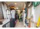 Organized garage space with ample storage and a variety of tools and equipment neatly arranged at 1056 Rally Dr, Polk City, FL 33868