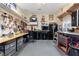 Well-organized garage with ample workspace, storage solutions, and tool racks for various projects at 1056 Rally Dr, Polk City, FL 33868