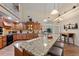 Stunning kitchen with granite counters, stainless steel appliances, and ample cabinet space at 1056 Rally Dr, Polk City, FL 33868