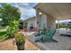 Outdoor patio space featuring lush plants, seating, and a shaded area perfect for relaxation at 1056 Rally Dr, Polk City, FL 33868