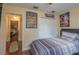 Bedroom with closet, ceiling fan, and hardwood floors with view to additional rooms at 1105 Watersedge Dr, Lakeland, FL 33801