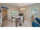 Bright dining area featuring a modern table, stylish chairs, and contemporary decor at 1105 Watersedge Dr, Lakeland, FL 33801