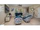 Comfortable living room showcasing stylish seating, a sleek media console, and plenty of natural light at 1105 Watersedge Dr, Lakeland, FL 33801