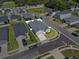 Aerial view of a single-Gathering home with a fenced yard and well-maintained landscaping in a residential neighborhood at 1106 Tropea Ln, Auburndale, FL 33823