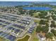 Community aerial view showing a lake nearby, many houses and a road to the neighborhood at 1106 Tropea Ln, Auburndale, FL 33823