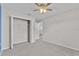Bedroom with ceiling fan and closet at 1106 Tropea Ln, Auburndale, FL 33823