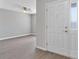 Inviting entryway featuring wood-look flooring and a white front door with glass sidelight at 1106 Tropea Ln, Auburndale, FL 33823