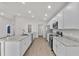 Modern kitchen featuring stainless steel appliances, stylish countertops, and ample cabinet space at 1106 Tropea Ln, Auburndale, FL 33823