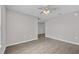 Spacious living room featuring modern ceiling fan and neutral-toned walls at 1106 Tropea Ln, Auburndale, FL 33823