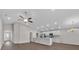 Bright and airy living area featuring a kitchen and lots of natural light at 1106 Tropea Ln, Auburndale, FL 33823