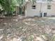 Exterior view of home and backyard, demonstrating home's AC unit at 1160 Austin St, Bartow, FL 33830