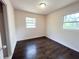 Cozy bedroom showcasing hardwood floors, neutral walls, and natural light at 1160 Austin St, Bartow, FL 33830