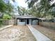 Charming single-story home with fenced in yard, wood pergola, and easy to maintain landscaping at 1160 Austin St, Bartow, FL 33830
