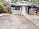 Inviting single-story home featuring a decorative pergola and walkway to the front door at 1160 Austin St, Bartow, FL 33830