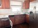 Kitchen featuring granite countertops, wood cabinets and stainless steel refrigerator at 1160 Austin St, Bartow, FL 33830