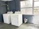 Laundry room includes full-size washer and dryer, and window providing natural light at 1160 Austin St, Bartow, FL 33830