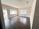 Inviting living room with lots of natural light and beautiful wood floors at 1160 Austin St, Bartow, FL 33830