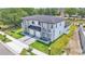 Aerial view showcasing the modern home's manicured lawn, and balcony at 1171 Windjammer Dr, Lakeland, FL 33803