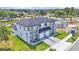 New modern construction home with a two-car garage, gray tones, and green lawn at 1171 Windjammer Dr, Lakeland, FL 33803