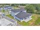 Aerial view of the home, showcasing a spacious backyard with manicured lawn and view of adjacent pond at 1171 Windjammer Dr, Lakeland, FL 33803