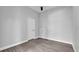 Cozy bedroom featuring wood floors, ceiling fan, and a simple design at 1171 Windjammer Dr, Lakeland, FL 33803