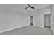 Neutrally painted bedroom with carpet and a closet, offering a versatile and comfortable living space at 1171 Windjammer Dr, Lakeland, FL 33803