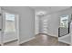 Home entryway featuring sleek flooring, modern lighting, staircase and a bright, airy atmosphere at 1171 Windjammer Dr, Lakeland, FL 33803