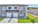 New construction with modern design, two-car garage, and manicured landscaping for a stylish home at 1171 Windjammer Dr, Lakeland, FL 33803