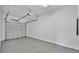 Spacious two-car garage with an epoxy floor and automatic door opener at 1171 Windjammer Dr, Lakeland, FL 33803