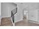 Bright interior shot showcasing the staircase with modern black railing and neutral tones at 1171 Windjammer Dr, Lakeland, FL 33803