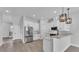 Open concept kitchen with stainless steel appliances and breakfast bar at 1171 Windjammer Dr, Lakeland, FL 33803