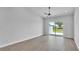 Spacious living room with sliding glass doors and ceiling fan at 1171 Windjammer Dr, Lakeland, FL 33803