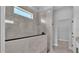 Walk-in shower with glass surround and custom tile work at 1171 Windjammer Dr, Lakeland, FL 33803