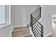 Minimalist staircase with black railings and bright interior at 1171 Windjammer Dr, Lakeland, FL 33803