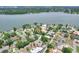 Beautiful aerial view of a home near a serene lake, highlighting its desirable location and neighborhood at 1218 Lake Point Ter, Lakeland, FL 33813