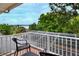 Balcony view with black furniture overlooking scenic lake at 1218 Lake Point Ter, Lakeland, FL 33813