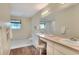 Spacious bathroom featuring double sinks, vanity area, and tile flooring at 1218 Lake Point Ter, Lakeland, FL 33813