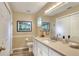 Well-lit bathroom with a modern vanity, framed mirror, and neutral color scheme at 1218 Lake Point Ter, Lakeland, FL 33813