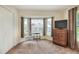 Bedroom with neutral carpet, closet and large windows at 1218 Lake Point Ter, Lakeland, FL 33813