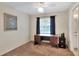Bedroom featuring a ceiling fan and a built in desk area at 1218 Lake Point Ter, Lakeland, FL 33813