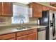 Functional kitchen with stainless steel appliances, granite countertops, and ample storage at 1218 Lake Point Ter, Lakeland, FL 33813