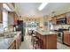 Well-equipped kitchen with a center island, stainless steel appliances, and view to the dining area at 1218 Lake Point Ter, Lakeland, FL 33813