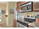 Kitchen featuring granite countertops, stainless steel appliances, and ample cabinet space at 1218 Lake Point Ter, Lakeland, FL 33813