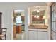 A charming kitchenette featuring a sink and granite countertop at 1218 Lake Point Ter, Lakeland, FL 33813