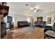 Spacious living room featuring hardwood floors and a charming brick fireplace at 1218 Lake Point Ter, Lakeland, FL 33813