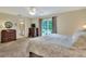 Spacious main bedroom with balcony access and en-suite bathroom at 1218 Lake Point Ter, Lakeland, FL 33813