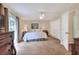Cozy main bedroom with en suite bathroom, ceiling fan and sliding door to patio at 1218 Lake Point Ter, Lakeland, FL 33813