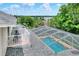 A top down view of the pool and its screened enclosure, from the second story of the house at 1218 Lake Point Ter, Lakeland, FL 33813