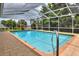 Inviting private pool surrounded by a screened enclosure at 1218 Lake Point Ter, Lakeland, FL 33813