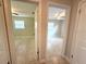 Two bedrooms with ceiling fans and natural light streaming through the windows at 135 E Columbia St, Lake Alfred, FL 33850